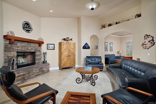 2021 Willow Glen Rd, Fallbrook, CA 92028 - living room with arched walkways, baseboards, a stone fireplace, tile patterned flooring, and recessed lighting
