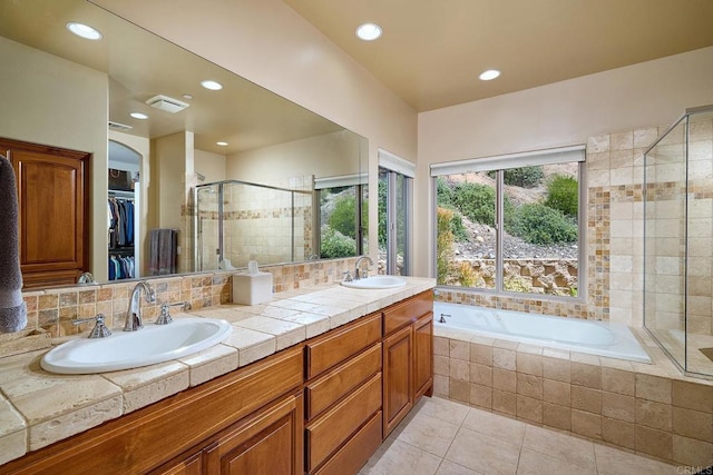 2021 Willow Glen Rd, Fallbrook, CA 92028 - bathroom featuring tile patterned floors, double vanity, a stall shower, a bath, and recessed lighting