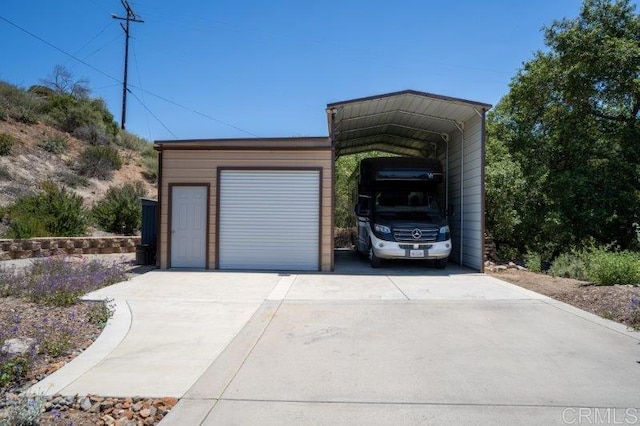 2021 Willow Glen Rd, Fallbrook, CA 92028 - garage featuring concrete driveway and a detached carport