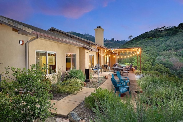 2021 Willow Glen Rd, Fallbrook, CA 92028 - rear view of property with a chimney, stucco siding, and a patio