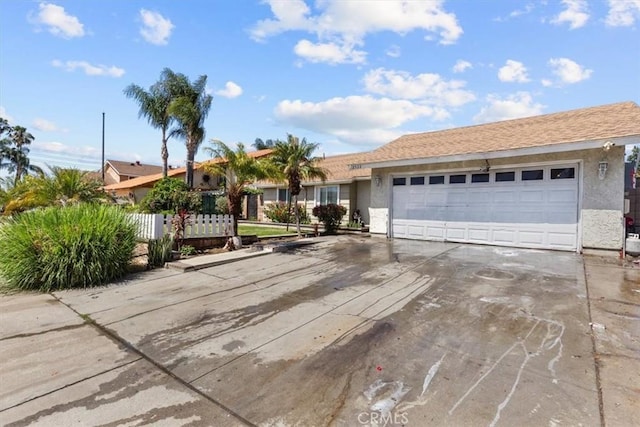 2522 S Calaveras Pl, Ontario, CA 91761 - ranch-style home with stucco siding, an attached garage, concrete driveway, and fence