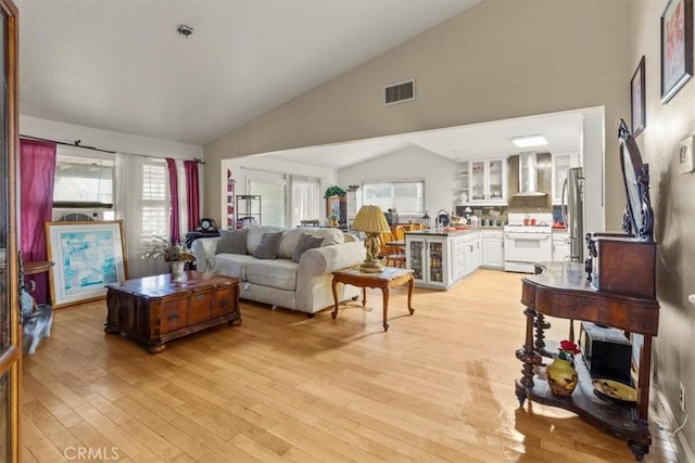 2522 S Calaveras Pl, Ontario, CA 91761 - living room featuring light wood-style flooring and high vaulted ceiling