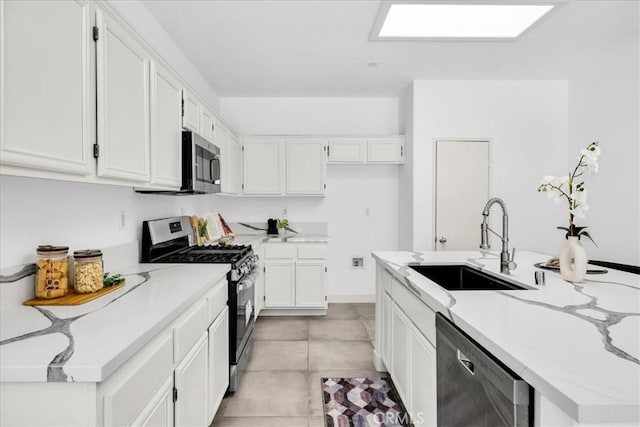 3773 Mission, Peak, Palm Springs, CA 92262 - kitchen with stainless steel appliances, a sink, white cabinets, and light stone countertops