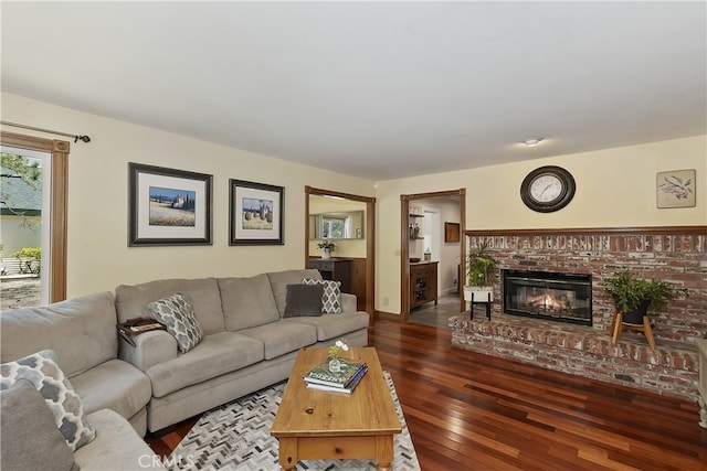 27513 St Bernard Ln, Lake Arrowhead, CA 92352 - living room featuring dark wood-style floors and a brick fireplace
