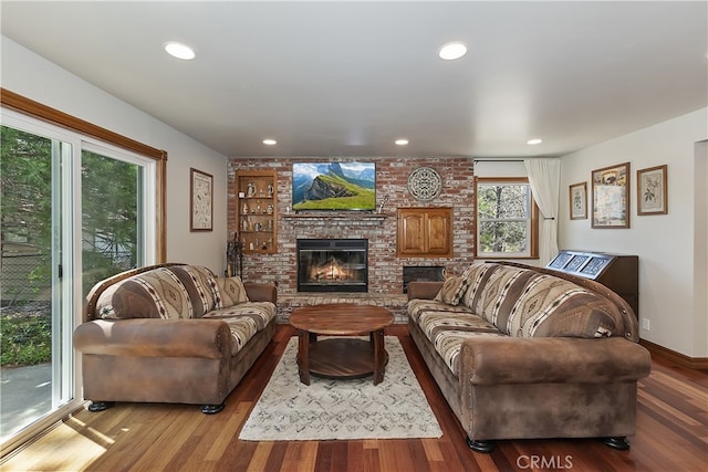 27513 St Bernard Ln, Lake Arrowhead, CA 92352 - living area featuring wood finished floors, a brick fireplace, recessed lighting, and baseboards