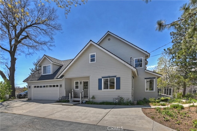 27513 St Bernard Ln, Lake Arrowhead, CA 92352 - traditional-style house with concrete driveway and an attached garage