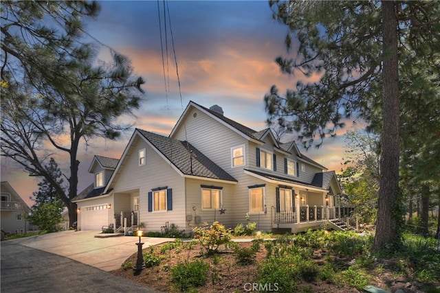 27513 St Bernard Ln, Lake Arrowhead, CA 92352 - view of front of house featuring concrete driveway and a garage