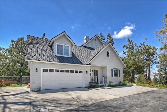 27513 St Bernard Ln, Lake Arrowhead, CA 92352 - traditional home with a chimney, an attached garage, concrete driveway, and a shingled roof