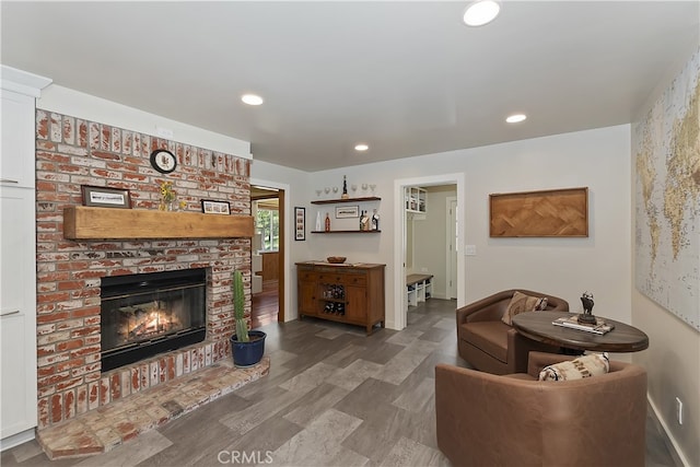 27513 St Bernard Ln, Lake Arrowhead, CA 92352 - living room with wood finished floors, baseboards, a brick fireplace, and recessed lighting