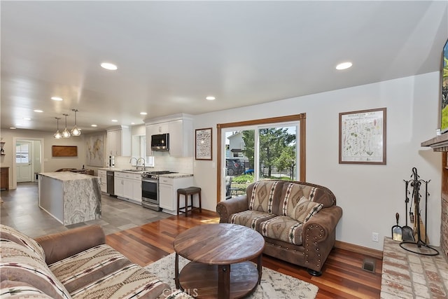 27513 St Bernard Ln, Lake Arrowhead, CA 92352 - living room with wood finished floors, recessed lighting, and baseboards