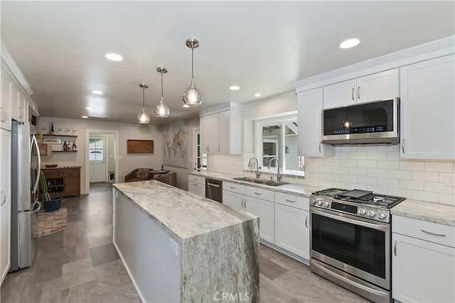 27513 St Bernard Ln, Lake Arrowhead, CA 92352 - kitchen with appliances with stainless steel finishes, a sink, a kitchen island, recessed lighting, and decorative backsplash