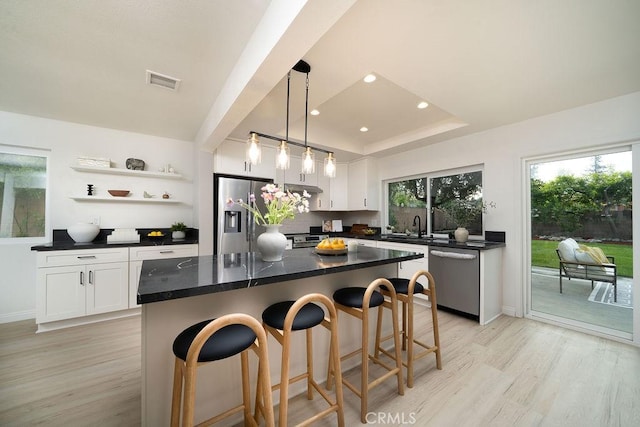 2610 King Way, Claremont, CA 91711 - kitchen with appliances with stainless steel finishes, open shelves, dark countertops, light wood-style floors, and recessed lighting