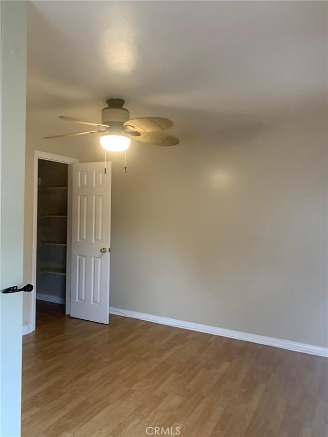 2707 S El Camino Real, San Clemente, CA 92672 - unfurnished room featuring baseboards, a ceiling fan, and light wood-type flooring