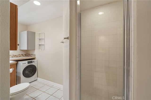 2707 S El Camino Real, San Clemente, CA 92672 - bathroom featuring washer / clothes dryer, vanity, a stall shower, tile patterned flooring, and toilet
