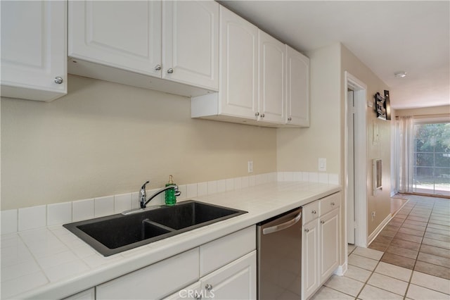 2707 S El Camino Real, San Clemente, CA 92672 - kitchen featuring a sink, stainless steel dishwasher, tile countertops, and white cabinets