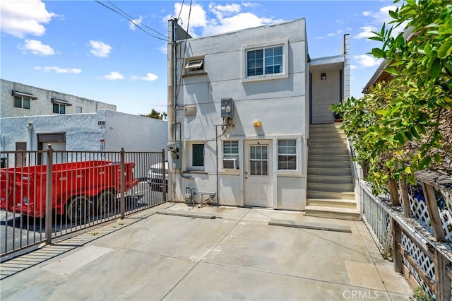 2707 S El Camino Real, San Clemente, CA 92672 - back of property featuring stucco siding, stairs, and fence