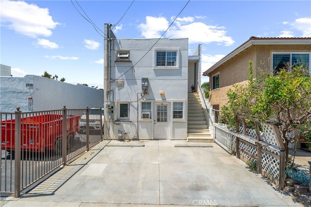 2707 S El Camino Real, San Clemente, CA 92672 - back of property with stairs, stucco siding, and fence