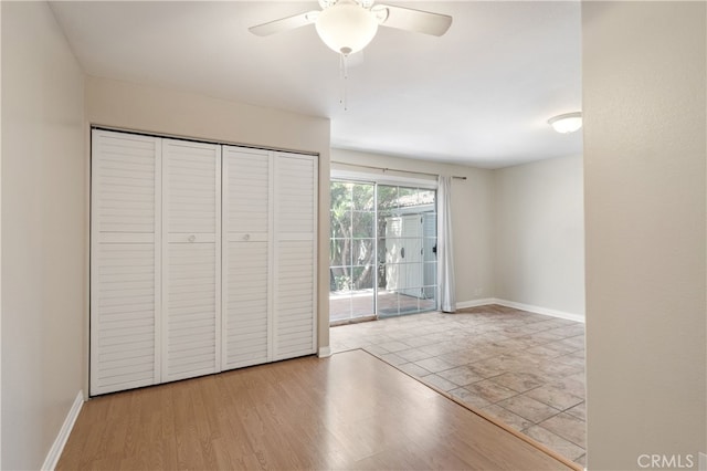2707 S El Camino Real, San Clemente, CA 92672 - unfurnished bedroom with access to exterior, baseboards, a ceiling fan, and a closet