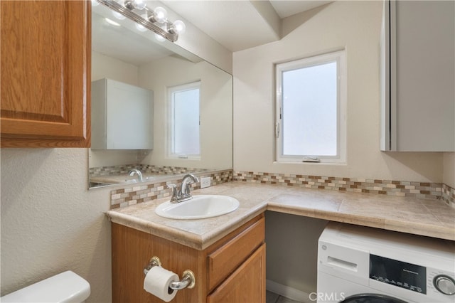 2707 S El Camino Real, San Clemente, CA 92672 - bathroom featuring washer / dryer, toilet, and vanity