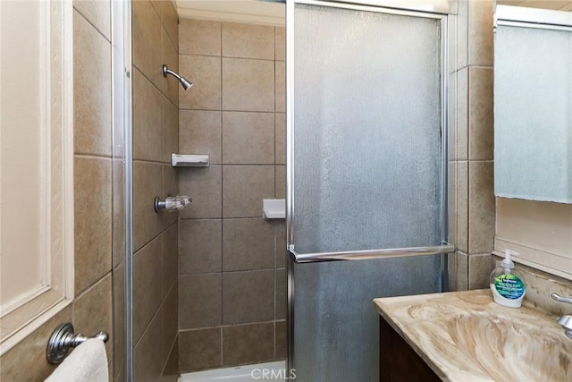 bathroom featuring a stall shower and vanity