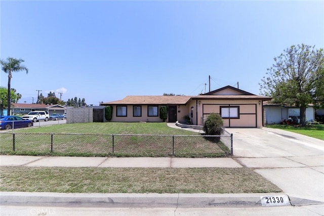 single story home with a garage and driveway