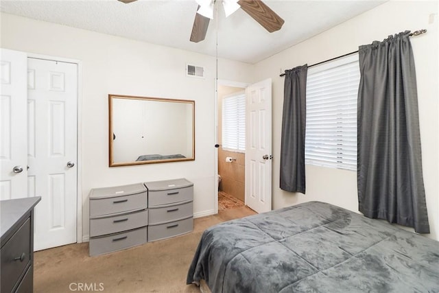 bedroom featuring light carpet and ceiling fan