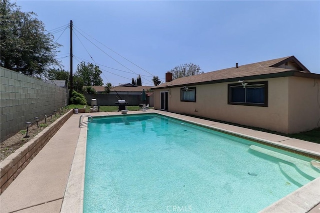 view of pool featuring a fenced backyard