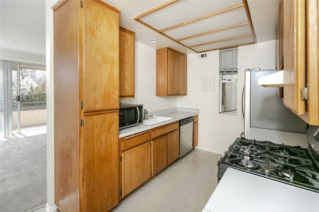 2807 W W Ave K12, Unit 256, Lancaster, CA 93536 - kitchen with appliances with stainless steel finishes, light countertops, light floors, a sink, and baseboards