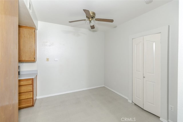 2807 W W Ave K12, Unit 256, Lancaster, CA 93536 - spare room featuring a ceiling fan, baseboards, and light flooring