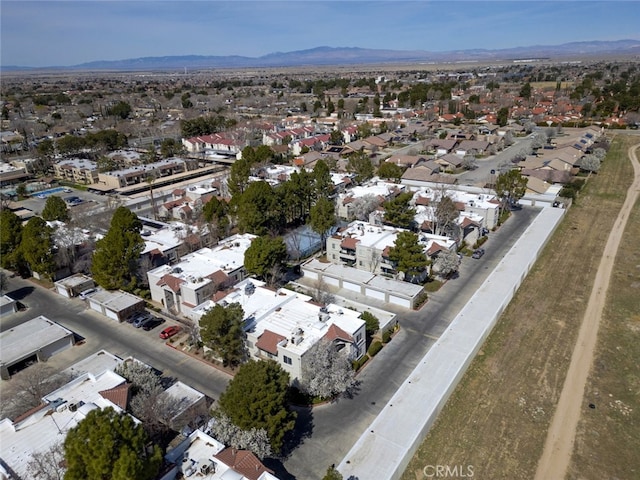 2807 W W Ave K12, Unit 256, Lancaster, CA 93536 - aerial view of property and surrounding area with nearby suburban area and a mountainous background