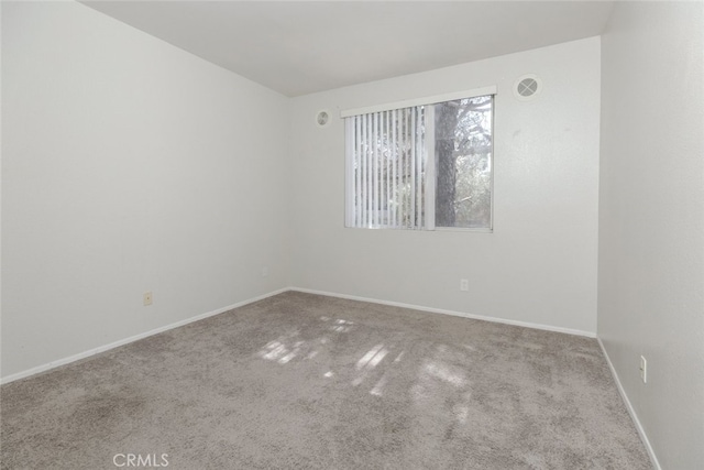 2807 W W Ave K12, Unit 256, Lancaster, CA 93536 - carpeted empty room featuring baseboards