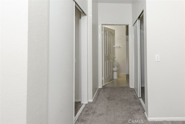 2807 W W Ave K12, Unit 256, Lancaster, CA 93536 - hallway featuring carpet flooring and baseboards
