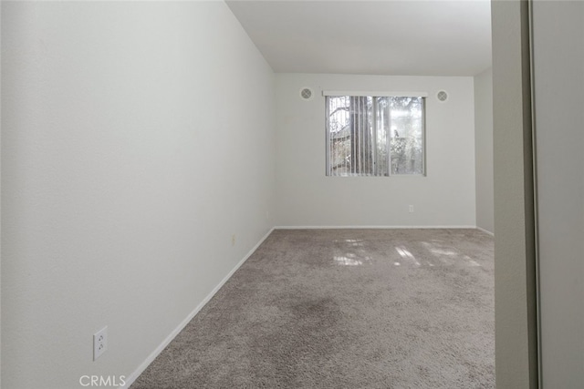 2807 W W Ave K12, Unit 256, Lancaster, CA 93536 - spare room with carpet floors and baseboards