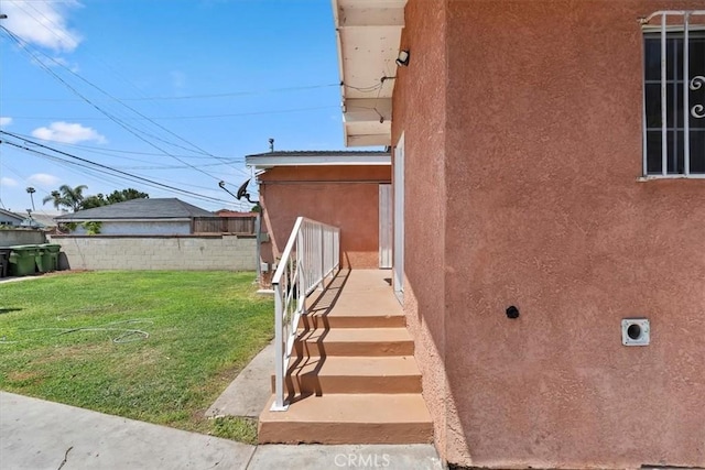 view of side of home featuring stucco siding