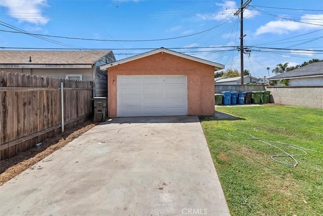 detached garage featuring driveway