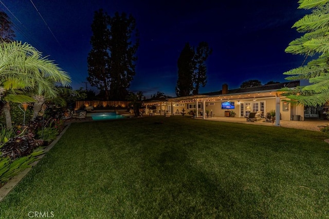 1448 W Domingo Rd, Fullerton, CA 92833 - yard at night featuring a patio area