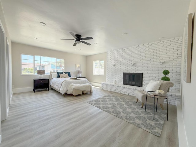 9944 Donner St, Santee, CA 92071 - bedroom featuring wood finished floors, baseboards, a brick fireplace, and ceiling fan