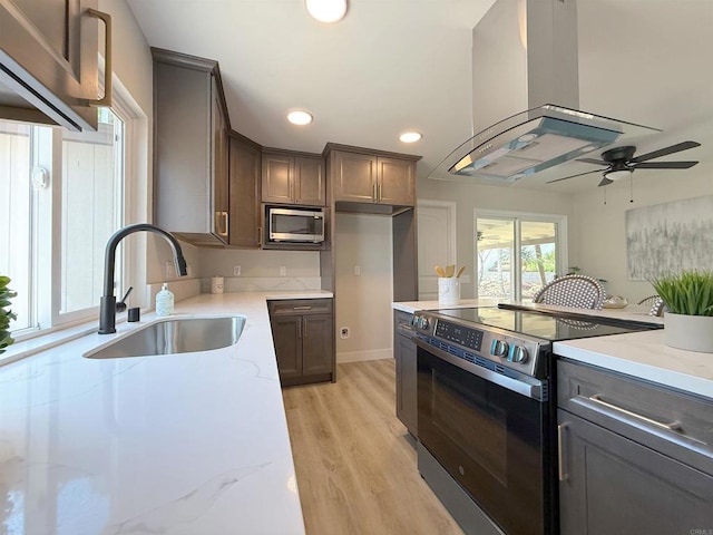 9944 Donner St, Santee, CA 92071 - kitchen with appliances with stainless steel finishes, a sink, island exhaust hood, light stone counters, and recessed lighting
