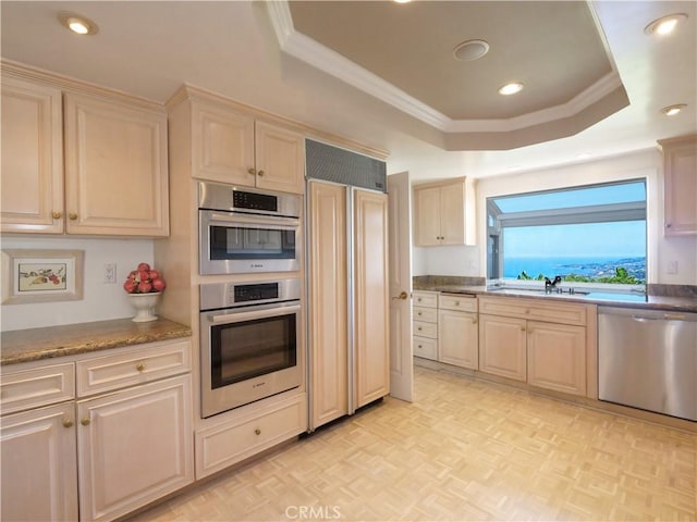 30915 Oceangrove Dr, Rancho Palos Verdes, CA 90275 - kitchen with stainless steel appliances, a raised ceiling, a sink, ornamental molding, and recessed lighting