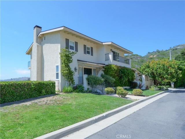 30915 Oceangrove Dr, Rancho Palos Verdes, CA 90275 - view of front facade with stucco siding, a front yard, and a chimney