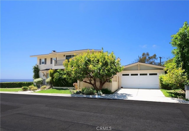 30915 Oceangrove Dr, Rancho Palos Verdes, CA 90275 - obstructed view of property featuring a garage, concrete driveway, and stucco siding