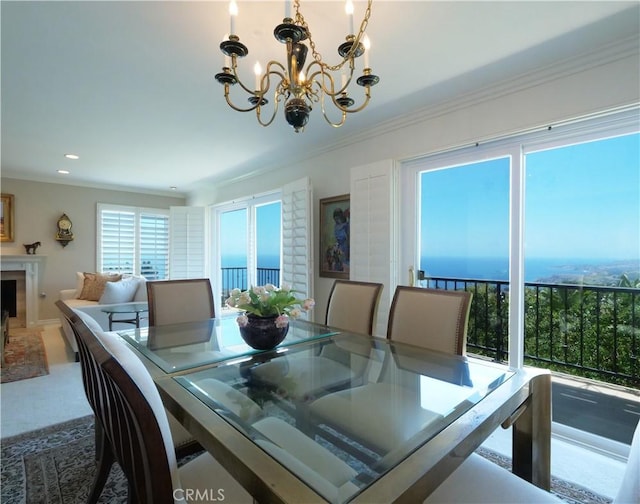 30915 Oceangrove Dr, Rancho Palos Verdes, CA 90275 - dining room with a chandelier, ornamental molding, carpet, a fireplace, and recessed lighting