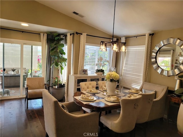 dining space with vaulted ceiling, dark wood-type flooring, and recessed lighting