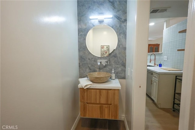 6670 Cozy Wood Ct, Whittier, CA 90601 - bathroom featuring wood finished floors, vanity, and tasteful backsplash