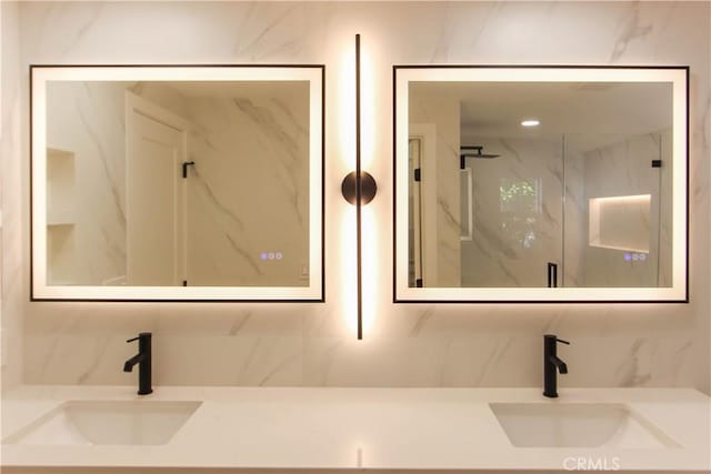 full bathroom featuring tasteful backsplash and double vanity