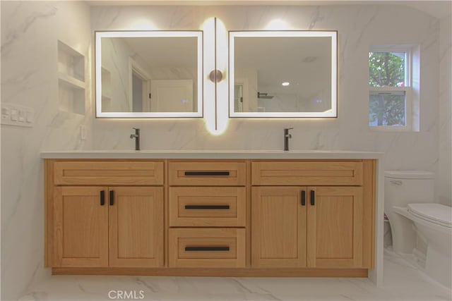 24701 Sarah Ln, Lake Forest, CA 92630 - bathroom featuring marble finish floors, double vanity, toilet, and decorative backsplash