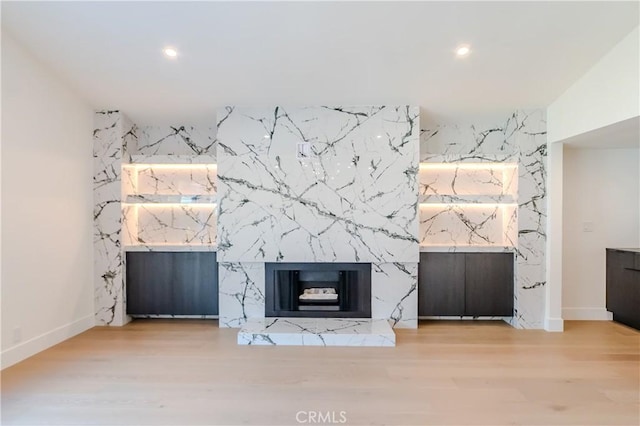 24701 Sarah Ln, Lake Forest, CA 92630 - unfurnished living room with recessed lighting, baseboards, wood finished floors, an accent wall, and a premium fireplace