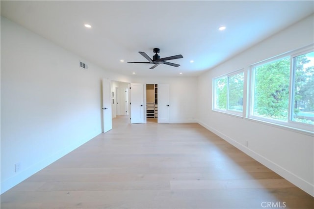 unfurnished room featuring recessed lighting, a ceiling fan, baseboards, and light wood finished floors