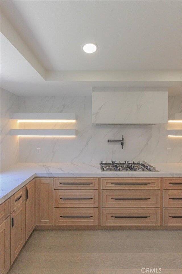 24701 Sarah Ln, Lake Forest, CA 92630 - kitchen with stainless steel gas stovetop, light stone countertops, and tasteful backsplash