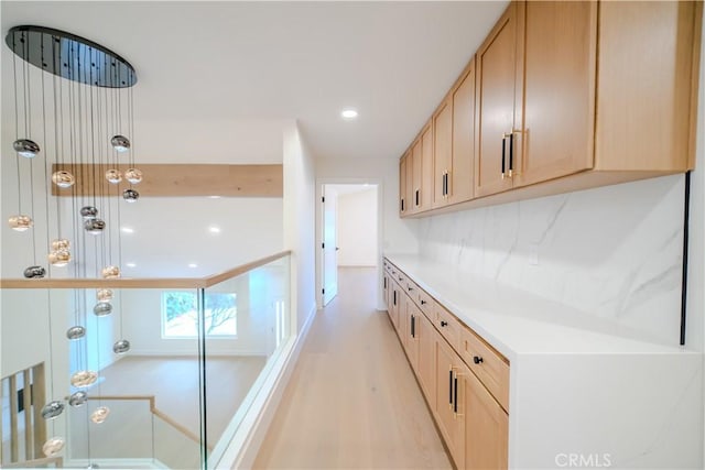 hall with recessed lighting and light wood-type flooring